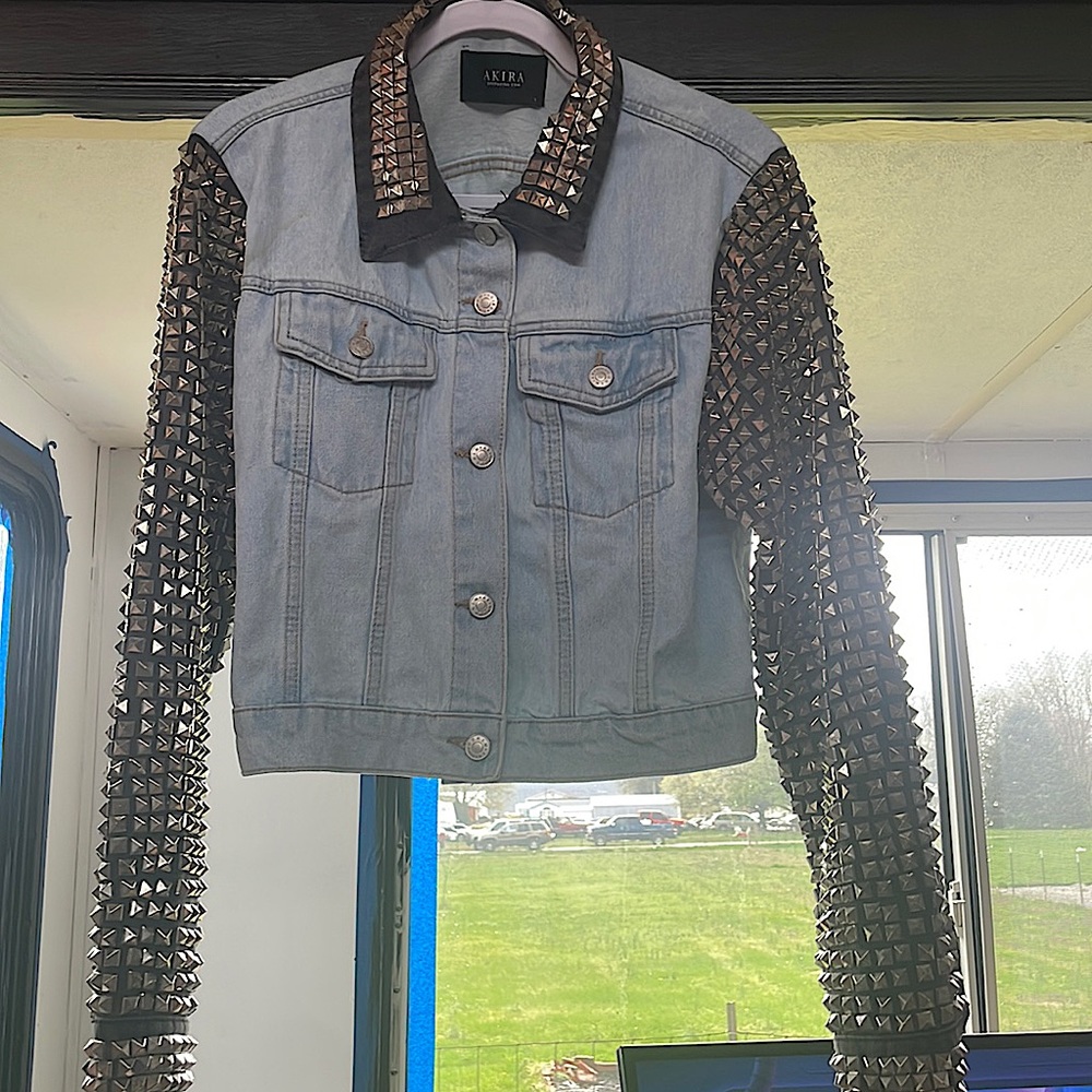 Large light blue/black studded blue Jean jacket by  AKIRA